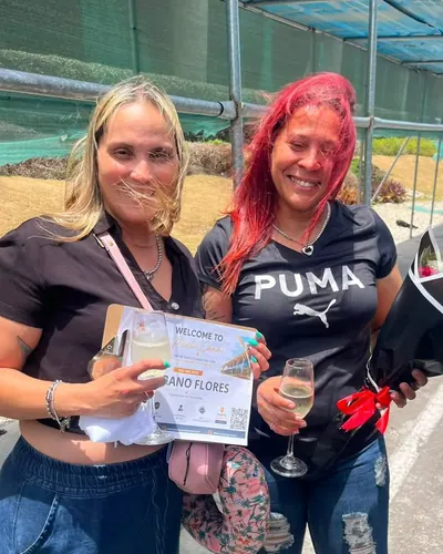 Two friends toasting on arrival at the airport