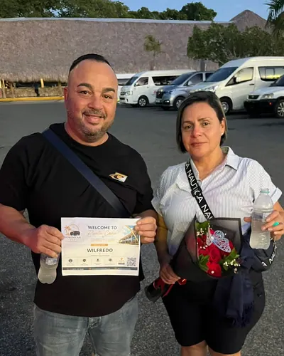 Couple with flowers welcomed at the airport